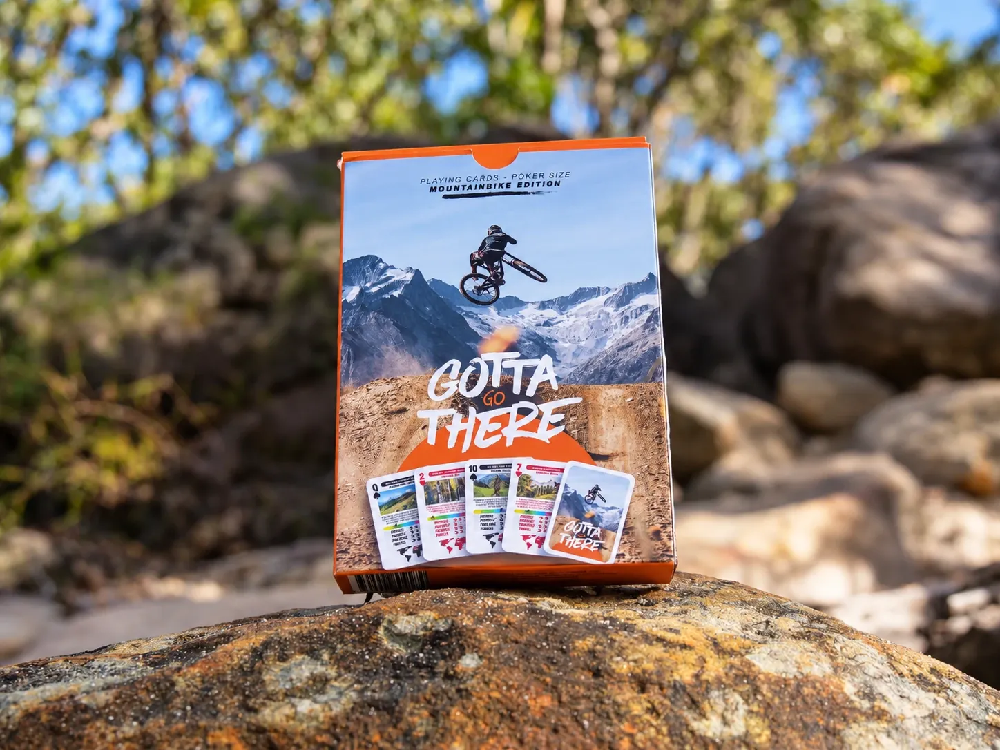 Gotta Go There MTB Edition box standing on a rock in the bush